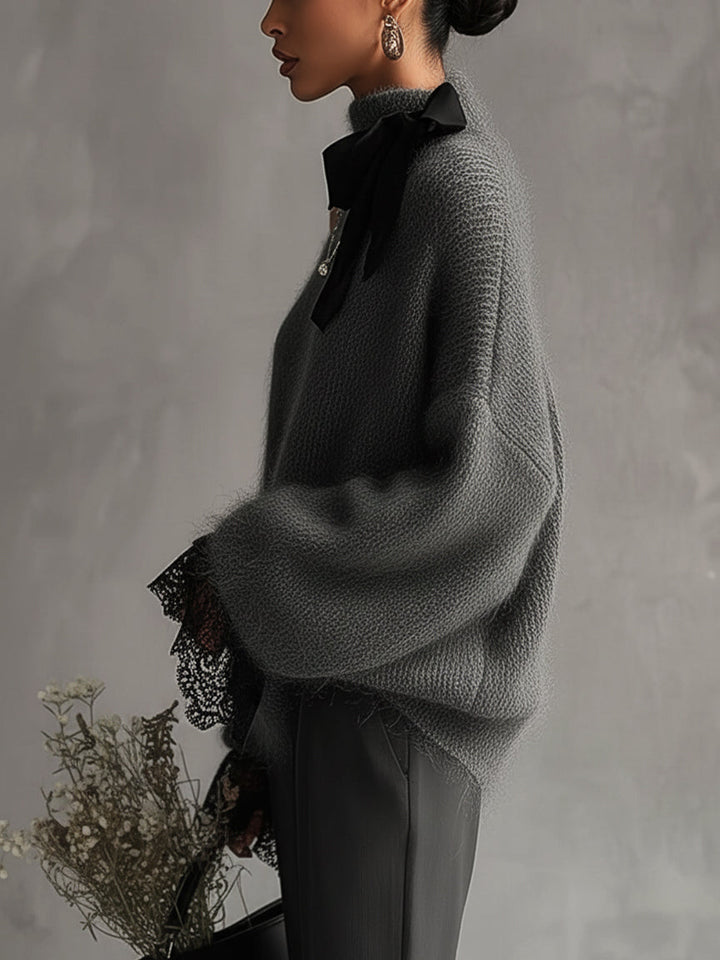 Maglione in maglia di mohair grigio con polsini in pizzo
