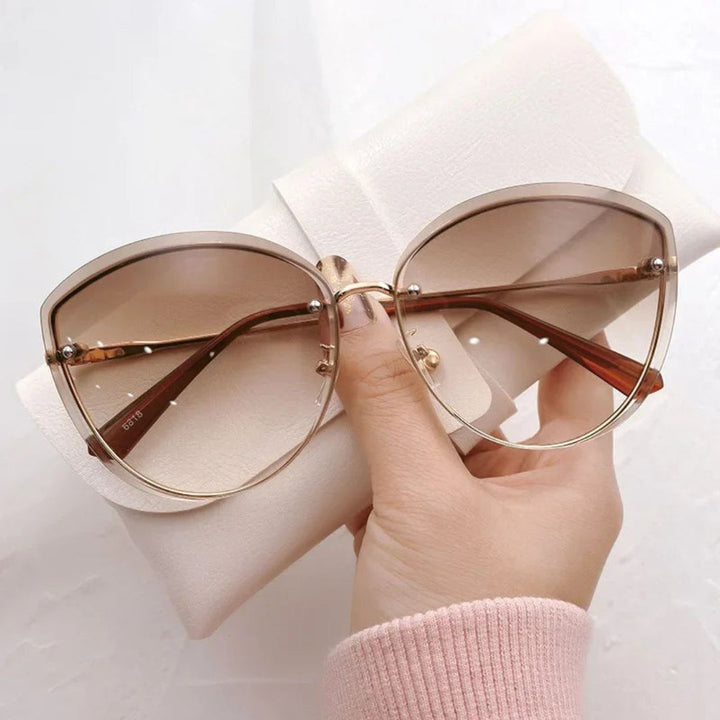 Occhiali da sole cat-eye senza montatura Celeste