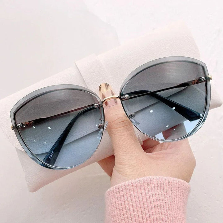 Occhiali da sole cat-eye senza montatura Celeste