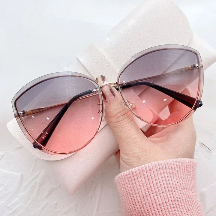 Occhiali da sole cat-eye senza montatura Celeste
