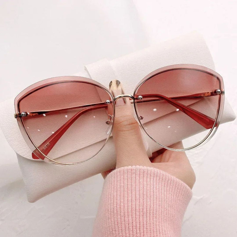 Occhiali da sole cat-eye senza montatura Celeste